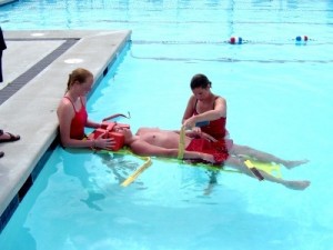 Lifeguards training to save a life during a medical emergency